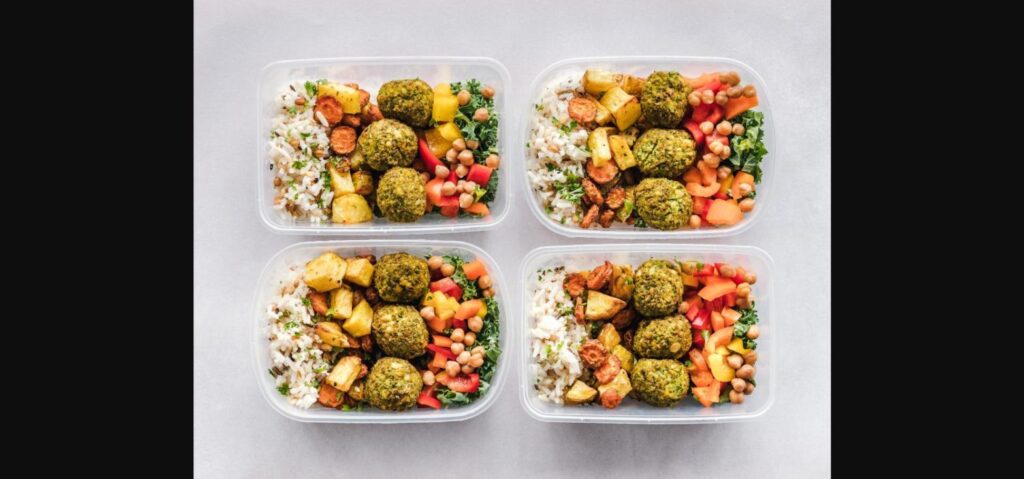 Kitchen hacks for faster meal prep - colorful containers with rice, veggies, and falafel