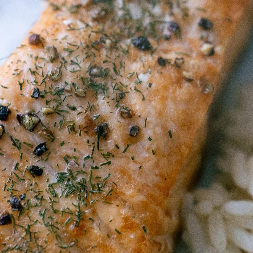 Seasoned air fryer salmon fillet served with rice