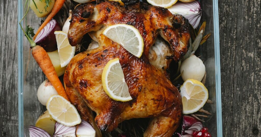 Sheet pan chicken and vegetables roasted on a baking tray for a quick weeknight dinner