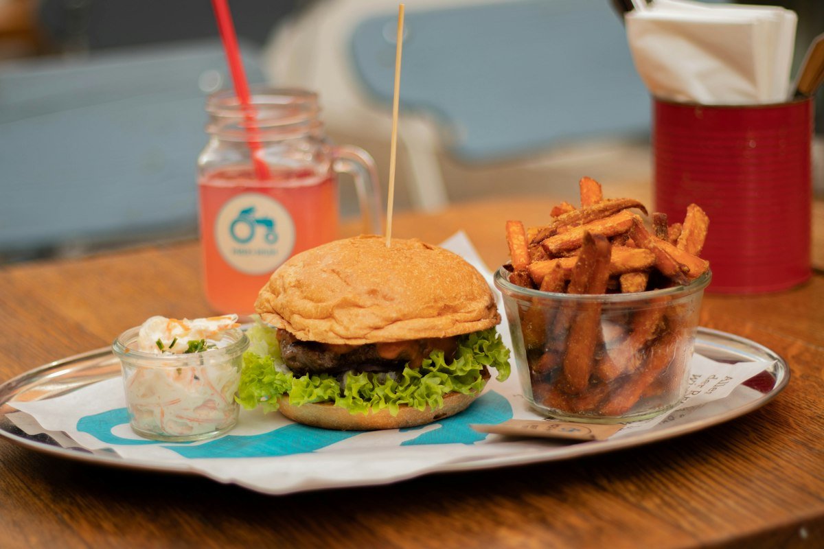 Burger served with a side of crispy fries on a plate
