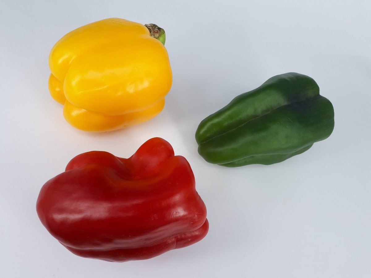 Red, yellow and green bell peppers used for chicken fajita bowls