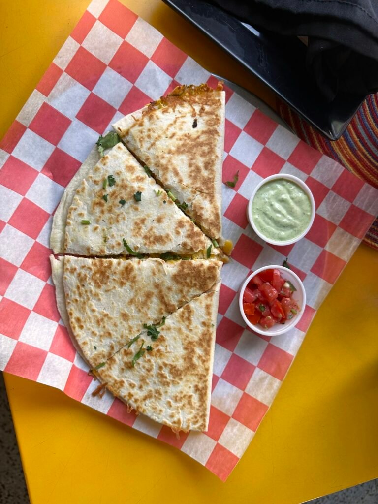 Chicken quesadilla wedges served with salsa and sour cream