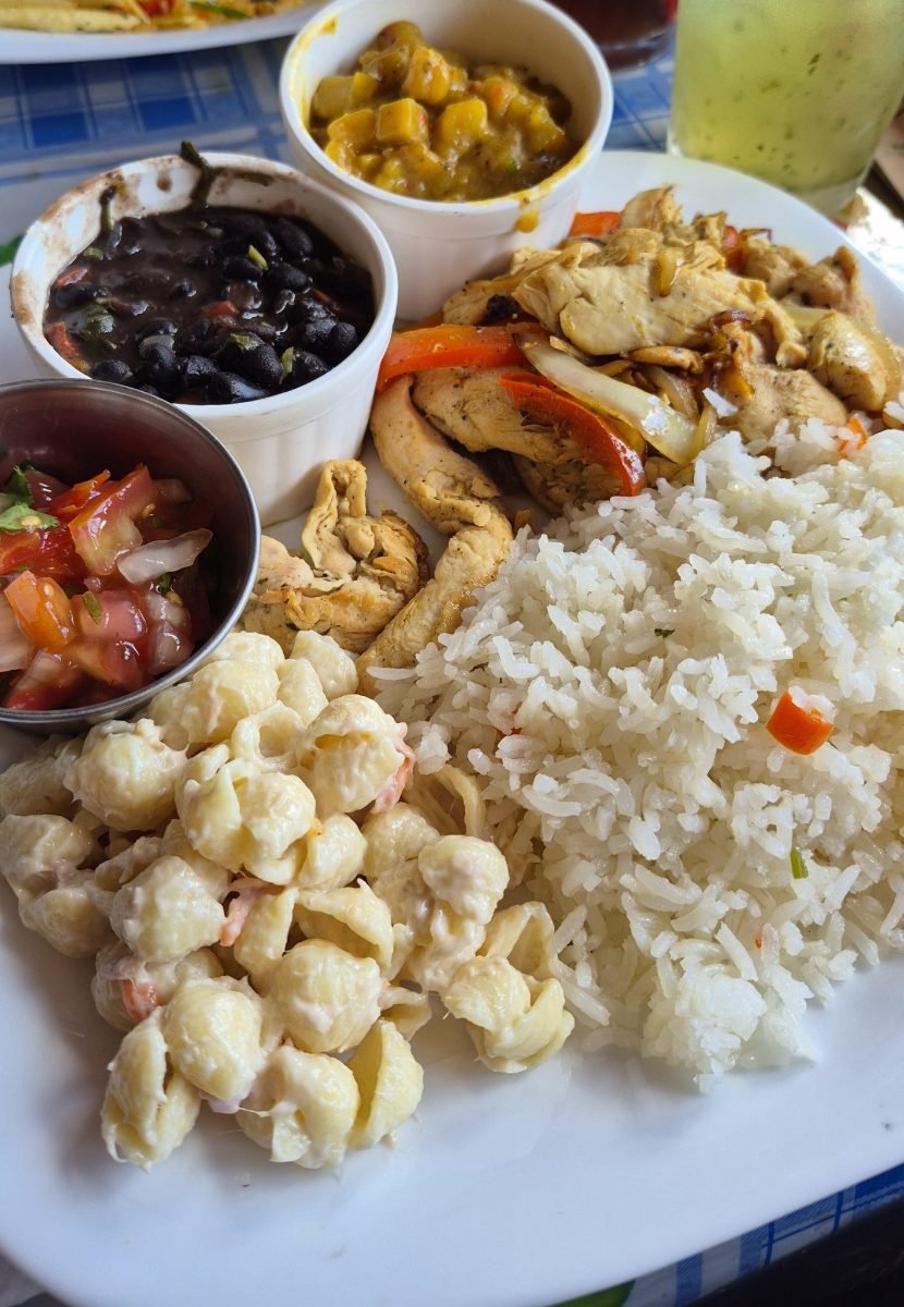 Meal prep plate with rice, grilled chicken, black bean dip and fresh tomato salsa