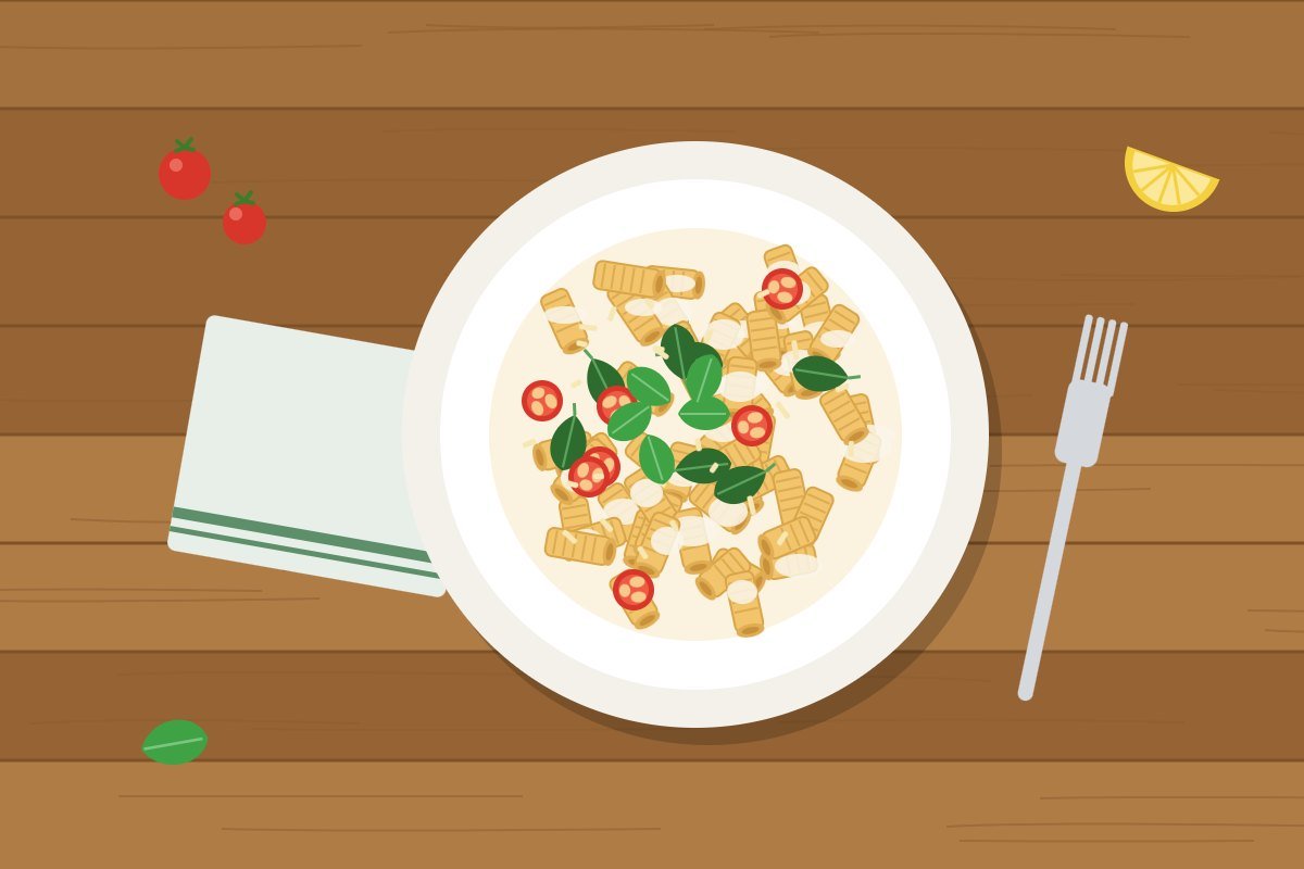 Plate of high-protein cottage cheese pasta topped with basil, Parmesan and cherry tomatoes