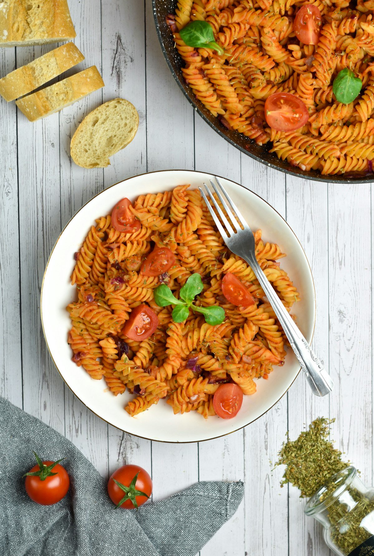 Creamy tomato pasta served on a white plate