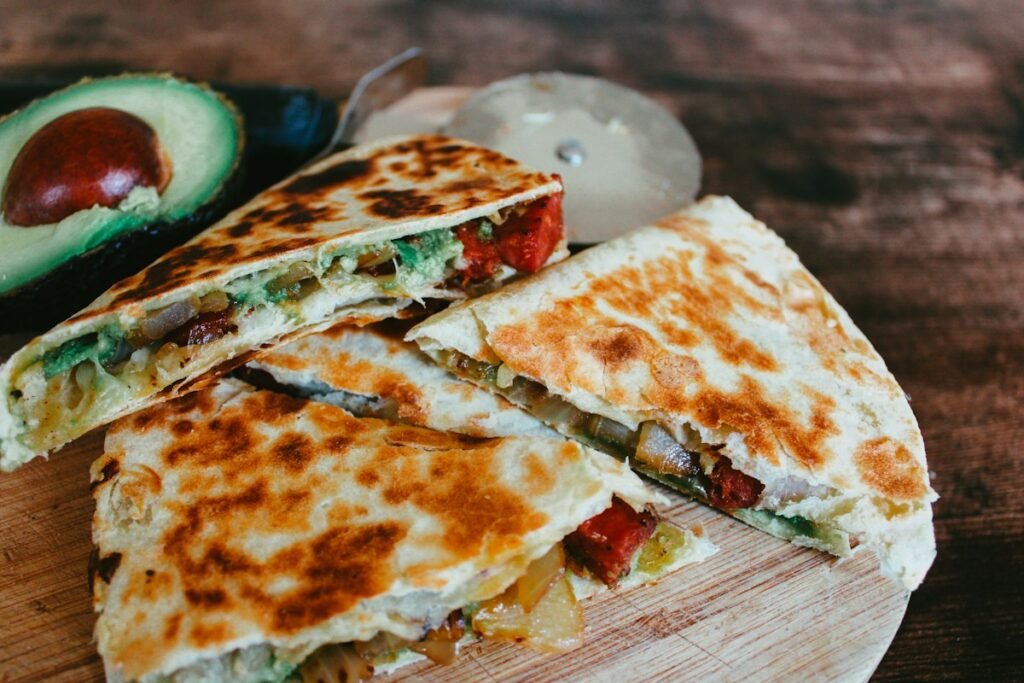 Crispy chicken quesadillas cut into triangles