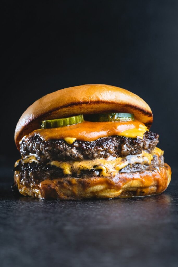 Double cheeseburger smash burger with crispy edges and melted cheese