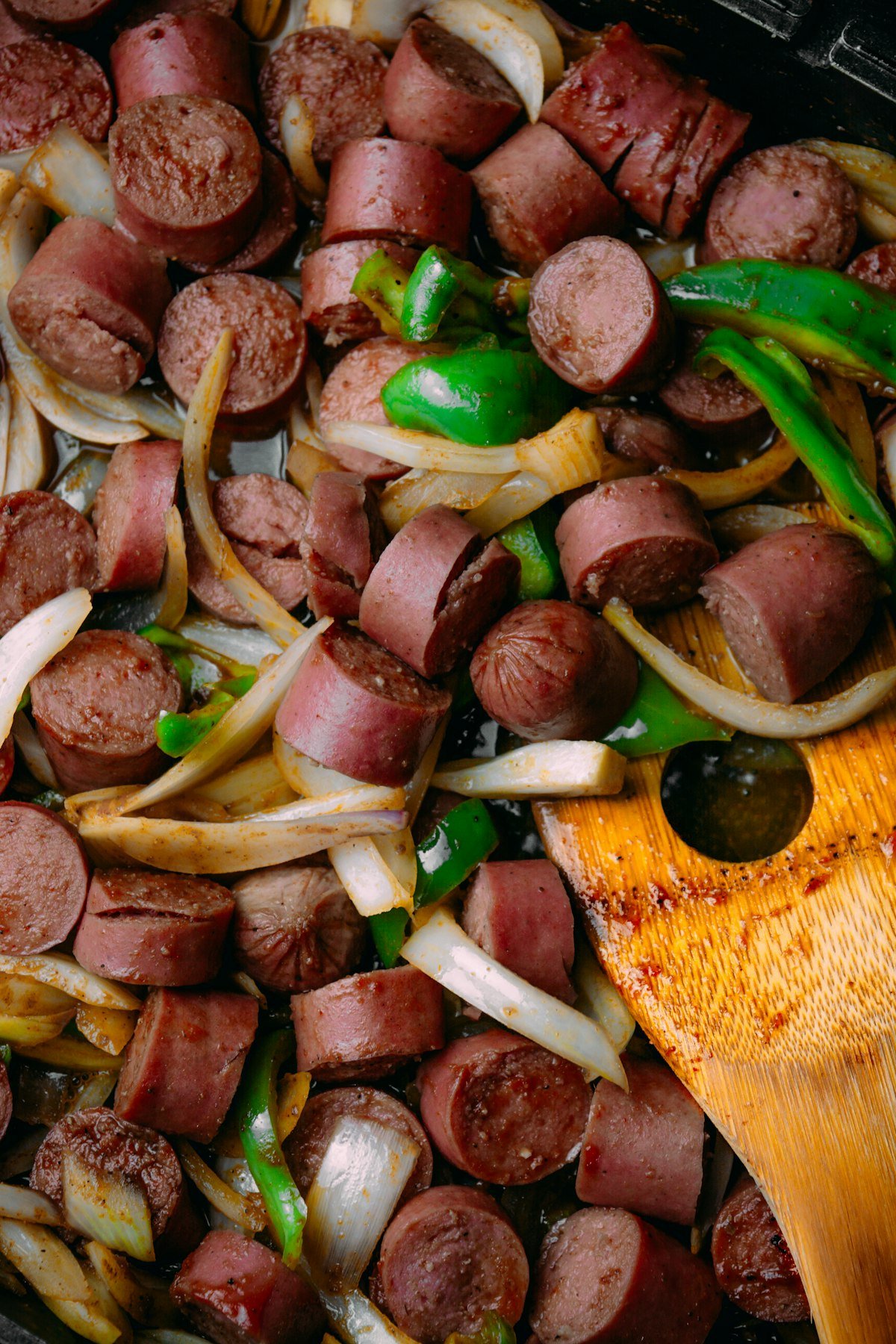 Sheet pan sausage and peppers with sliced Italian sausage, green bell peppers and caramelized onions